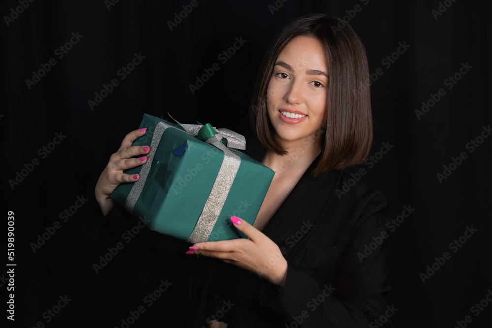 Girl model with gifts Christmas party on black background Girl model with gifts Christmas party on black background