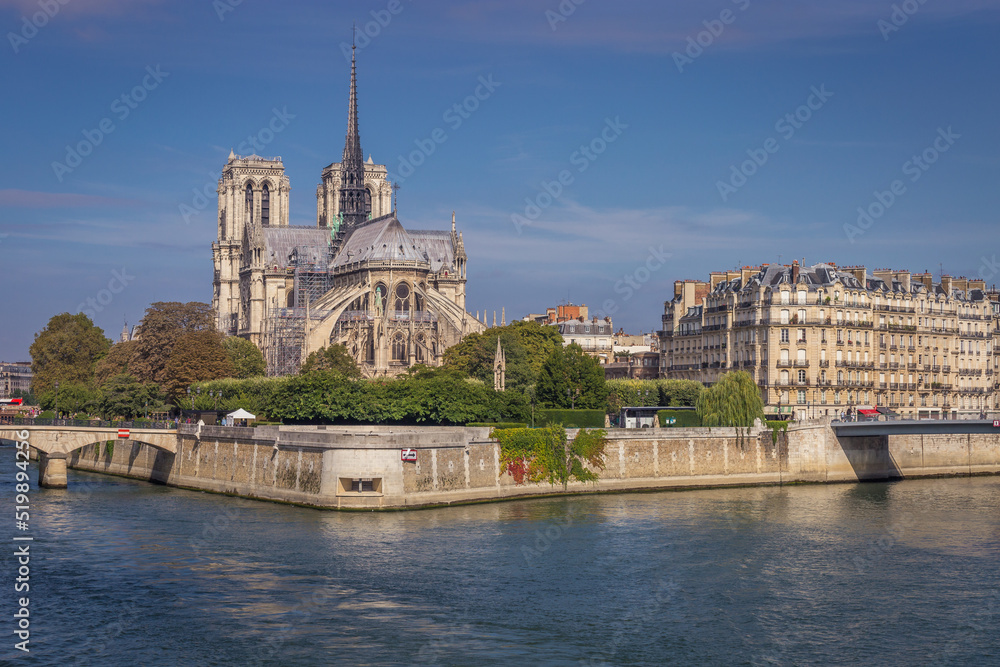 Notre Dame Cathedral of Paris and Seine river at sunny day, France