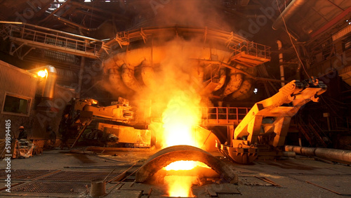 Obraz na plátně Hot dark workshop of steel production in electric furnaces, with burning fire and smoke