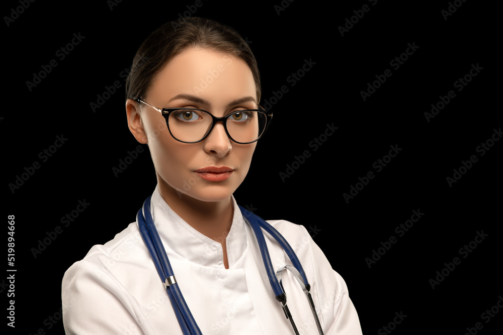 Portrait of an attractive young female doctor in white coat