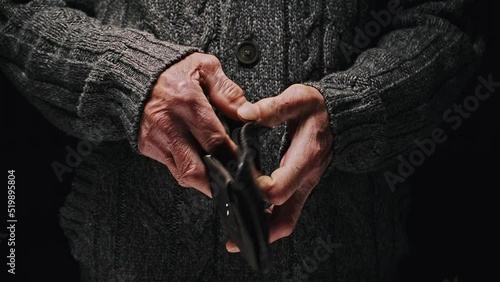 Empty wallet in senior hands, opens and empty, no money. Poverty in retirement concept