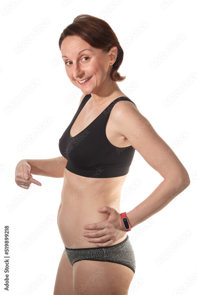 A beautiful woman in early pregnancy shows off her tummy. Happy future mom A beautiful woman in early pregnancy shows off her tummy. Happy future mom