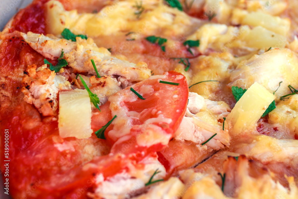Pizza with pineapple, chicken, tomatoes and cheese Pizza with pineapple, chicken, tomatoes and cheese