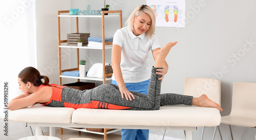 Physiotherapist working wit...