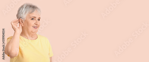 Senior woman with hearing a...