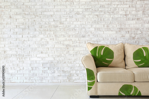 Comfortable sofa with print...