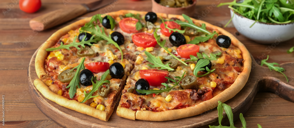 Tasty pizza with olives on wooden background