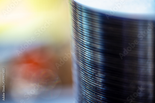 Selective focus on a sleeve of compact discs CD's used for storing electronic media. photo