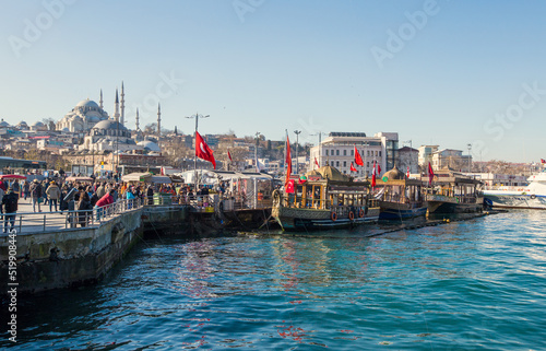 Eminönü quay with boats and food market in Istambul, Turkey photo