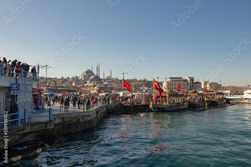 Eminönü quay with boats and food market in Istambul, Turkey