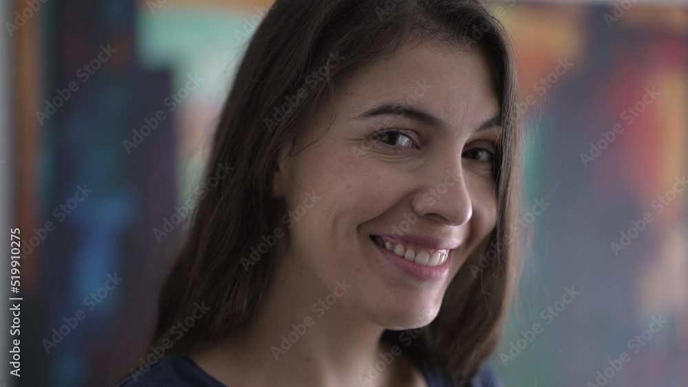Portrait of person smiling at camera. Closeup happy woman face in 30s Portrait of person smiling at camera. Closeup happy woman face in 30s