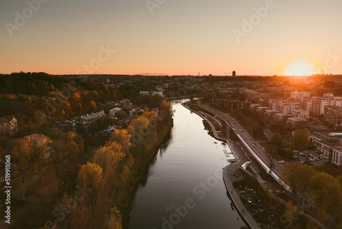 Scenic aerial view of Vilnius Old Town and Neris river at nightfall. Sunset landscape. Vilnius, Lithuania.