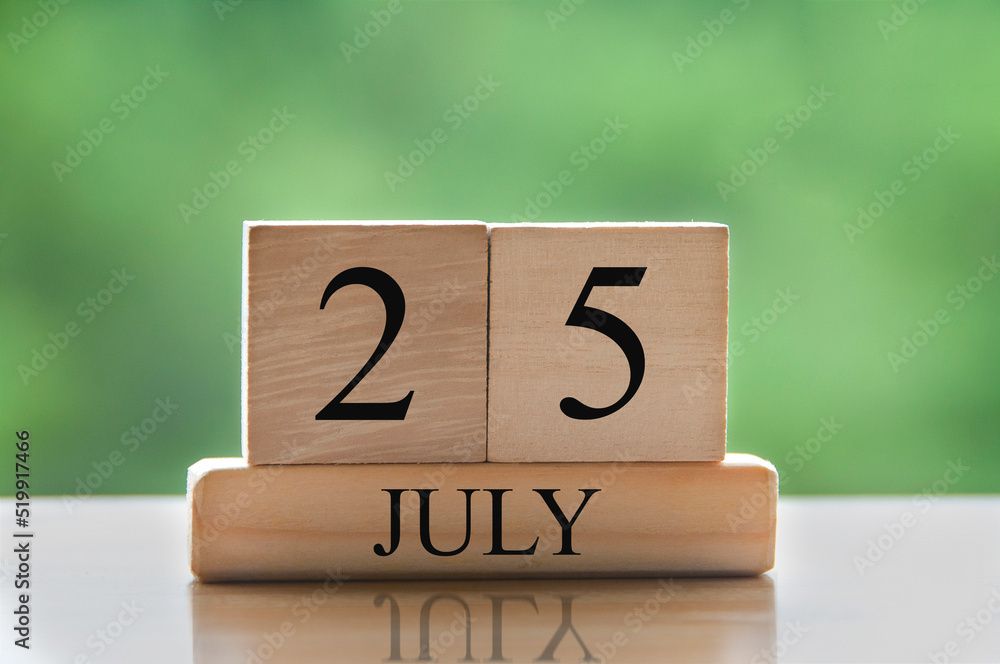 July 16 calendar date text on wooden blocks with blurred background park. Conceptual July 16 calendar date text on wooden blocks with blurred background park. Conceptual