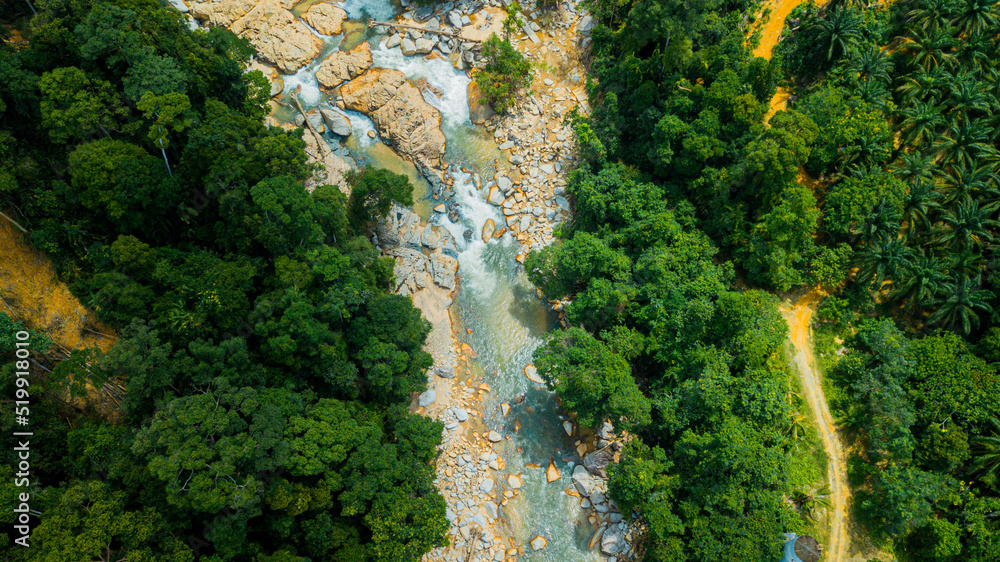 Aerial drone view of forest scenery with a river stream in Hutan Lipur Belukar Bukit, Kuala Berang, Terengganu, Malaysia. Aerial drone view of forest scenery with a river stream in Hutan Lipur Belukar Bukit, Kuala Berang, Terengganu, Malaysia.
