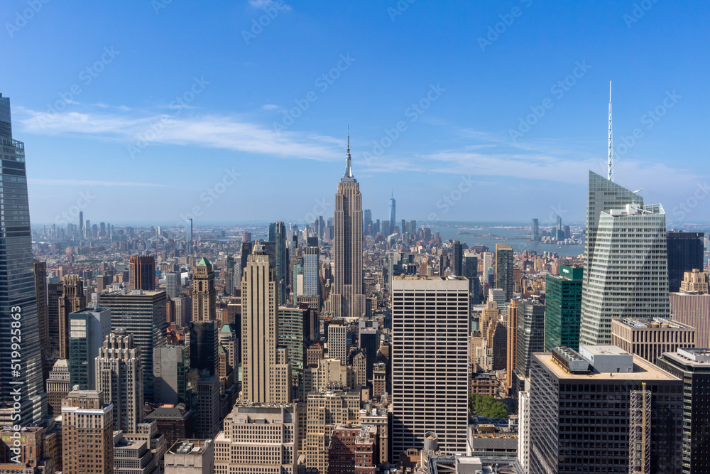 Fototapeta premium Sunny daytime cityscape skyline view of skyscrapers on Manhattan Island in New York City, New York, USA