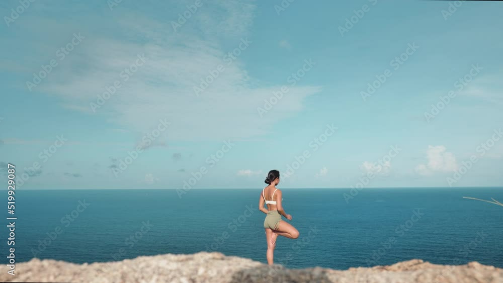 Asian woman improves balance for body, mind and spirit with yoga Asian woman improves balance for body, mind and spirit with yoga