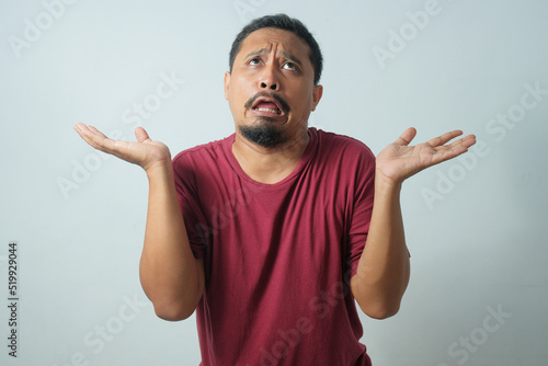 funny expression of man with eye rolled