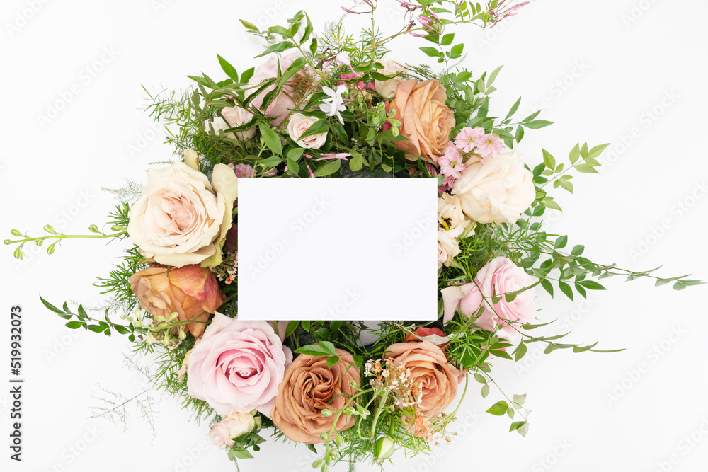 Fresh flower flat lay with blank stationery card