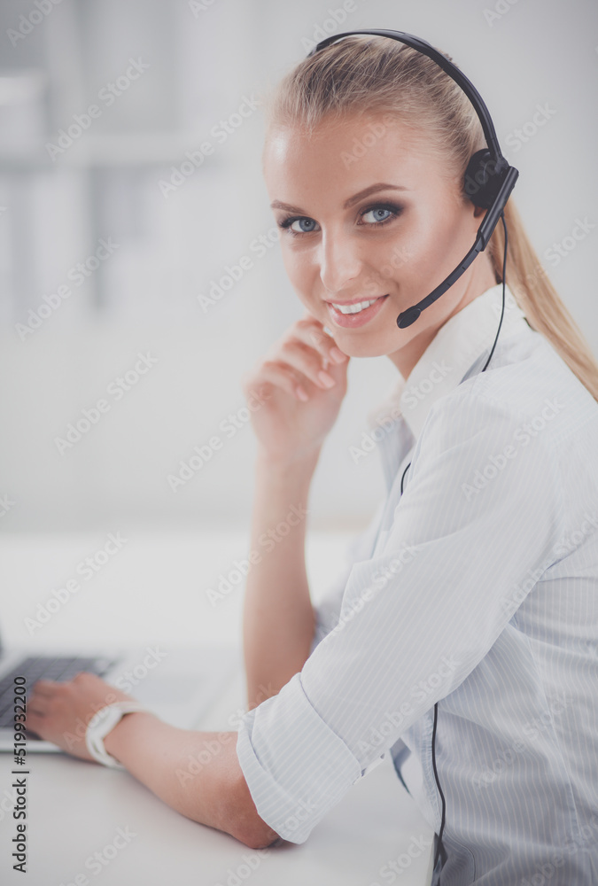 Close-up portrait of a customer service agent sitting at office Close-up portrait of a customer service agent sitting at office