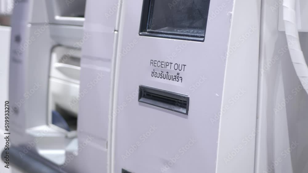 taking printed receipt from the cashier self machine kios when finish self payment in supermarket store taking printed receipt from the cashier self machine kios when finish self payment in supermarket store