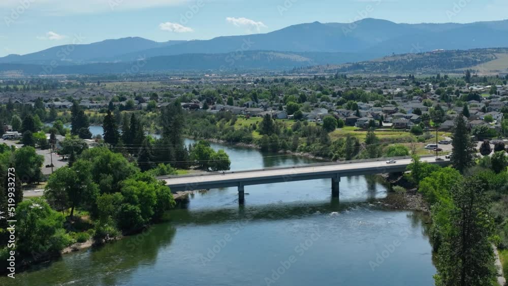 Aerial shot of Spokane's lush landscape with the Spokane River and a crossing bridge in the center of the shot. Aerial shot of Spokane's lush landscape with the Spokane River and a crossing bridge in the center of the shot.