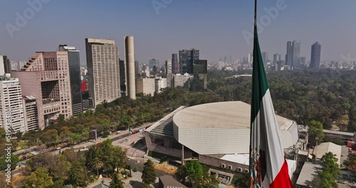 Mexico City Aerial v79 establishing shot passing by a giant mexican flag, flyover bosque de chapultepec and auditorium towards polanco residential neighborhood - Shot with Mavic 3 Cine - January 2022 photo