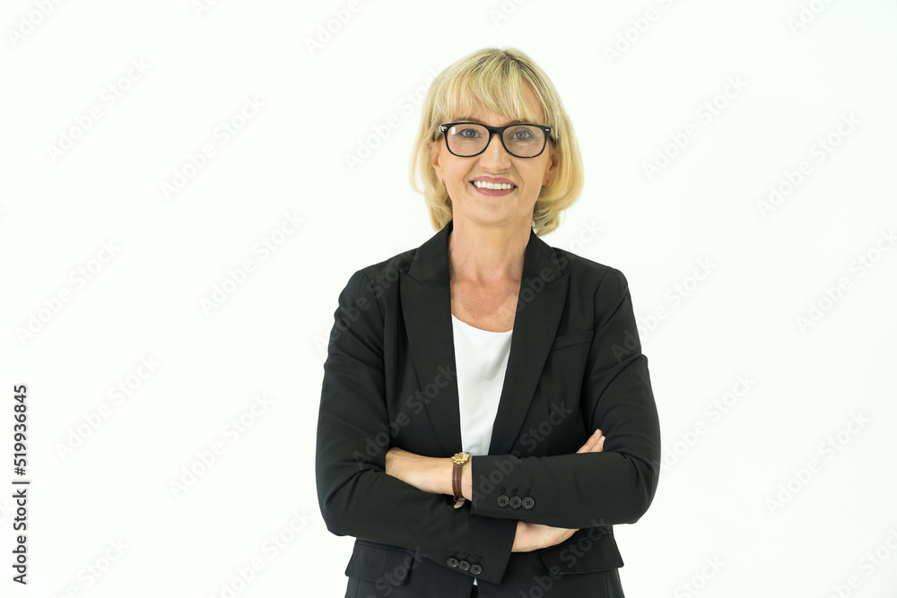 Portrait of senior business woman wear suit on white background. Smiling senior business woman standing with arm crossed on white background Portrait of senior business woman wear suit on white background. Smiling senior business woman standing with arm crossed on white background
