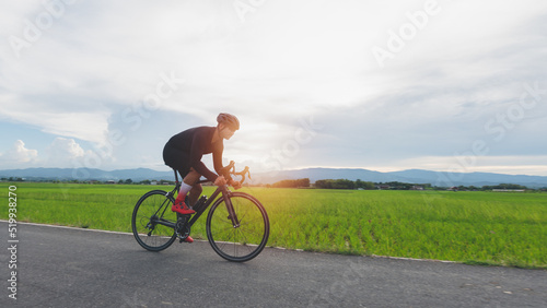 Fototapeta Naklejka Na Ścianę i Meble -  sportsman person cycling on the road, outdoor lifestyle, an athlete is a race, active adventure riding, bike, summer exercise concept