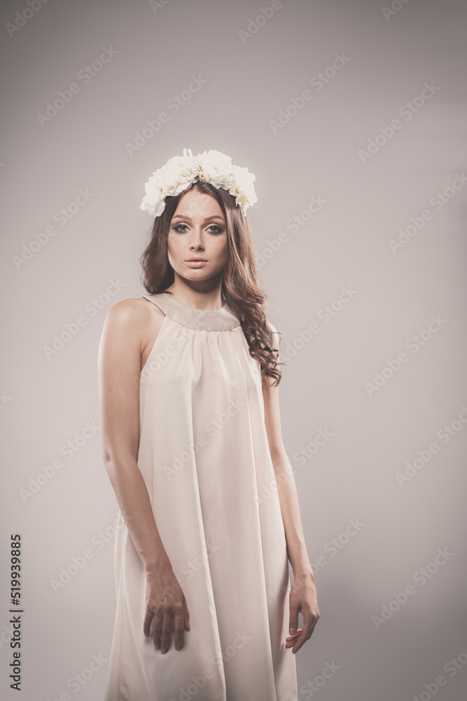 Portrait of a beautiful woman with flowers in her hair Portrait of a beautiful woman with flowers in her hair