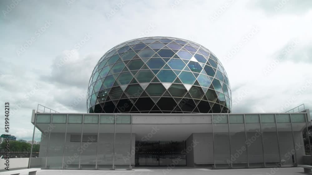 A static wide shot of modern glass dome rooftop structure of the Seine