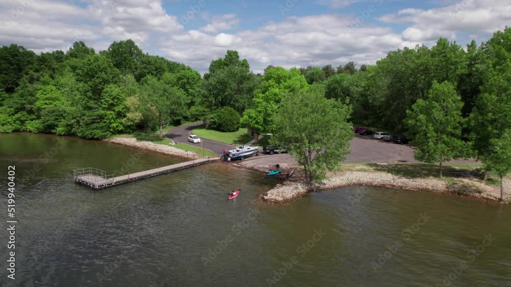 An aerial shot of traditional ferry boat moored at the dock on the lakeside. An mesmerizing view of nature An aerial shot of traditional ferry boat moored at the dock on the lakeside. An mesmerizing view of nature