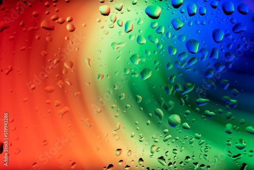 abstract picture with rainbow under water drops