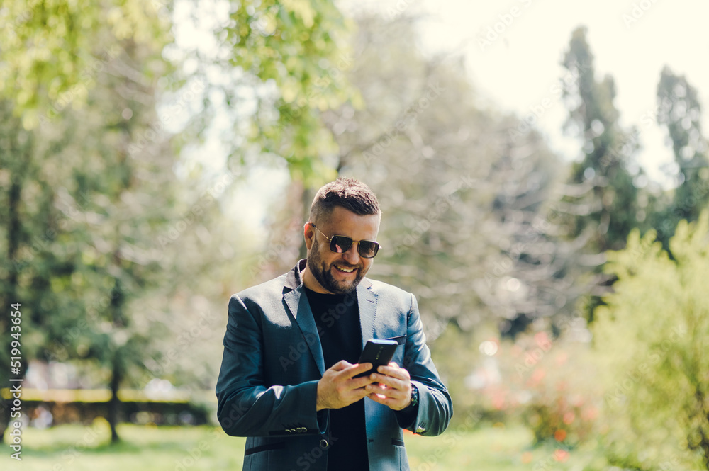 Handsome middle-eastern guy businessman posing next to office center.Worried European business people looking at wristwatch and talking on mobile with colleagues that late appointment in the city.
Handsome middle-eastern guy businessman posing next to office center.Worried European business people looking at wristwatch and talking on mobile with colleagues that late appointment in the city.
