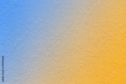 Texture of old light blue and yellow paper background, with holographic gradient. Structure of craft golden cardboard