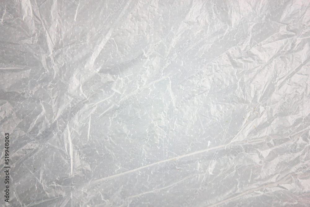 Naklejka premium Authentic texture background of plastic light package. White, overprinted plastic bag background. Crumpled package, packaging, film.