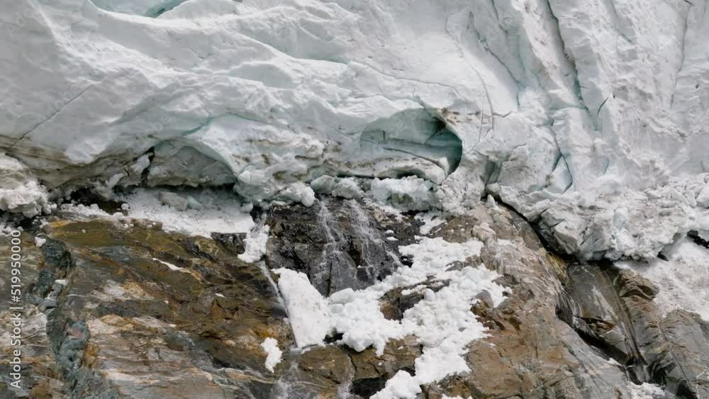 Water Flowing From The Bottom Of Adishi Glacier In Svaneti Region In Georgia - Aerial pull back shot Water Flowing From The Bottom Of Adishi Glacier In Svaneti Region In Georgia - Aerial pull back shot