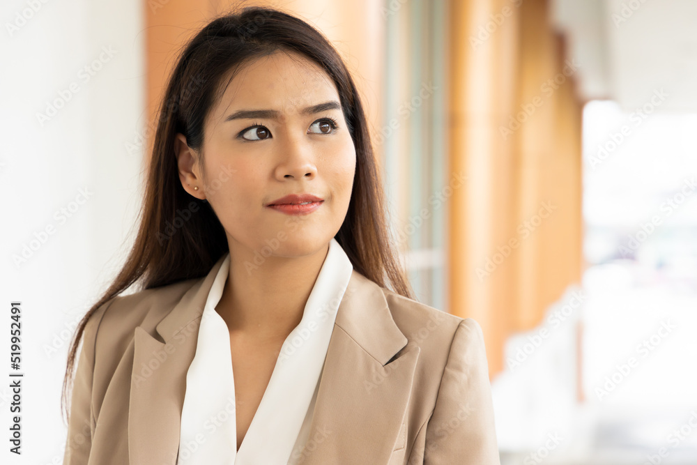 Happy office worker woman looking up with hope and positive expression Happy office worker woman looking up with hope and positive expression