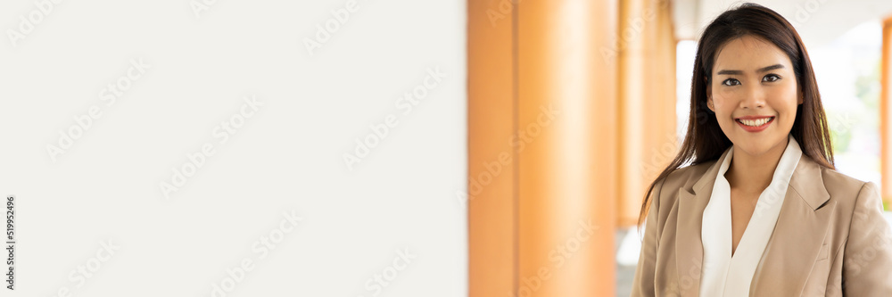 Happy smiling office worker woman looking at you, horizontal header design crop with blank space