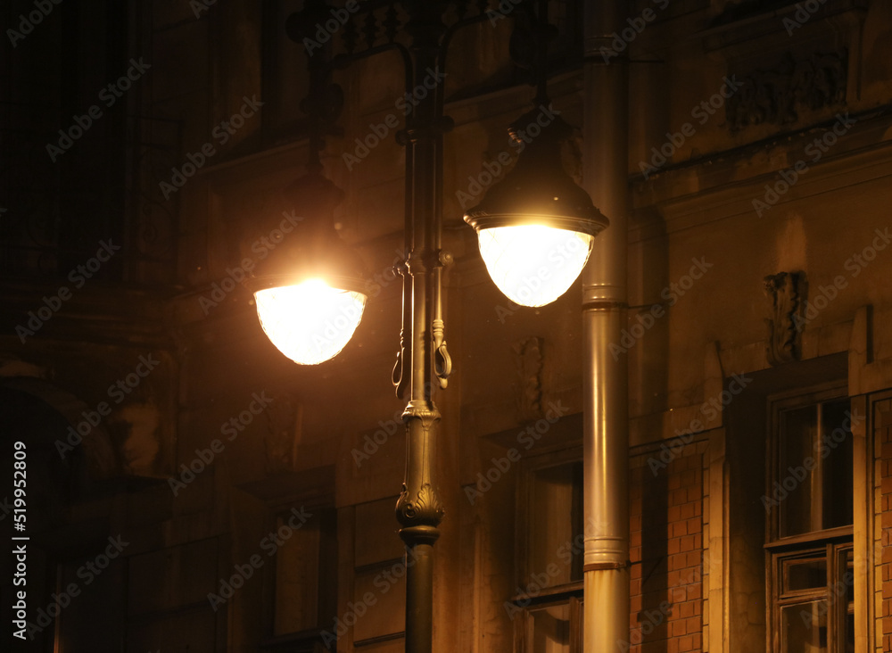 The lantern glows indoors at night.