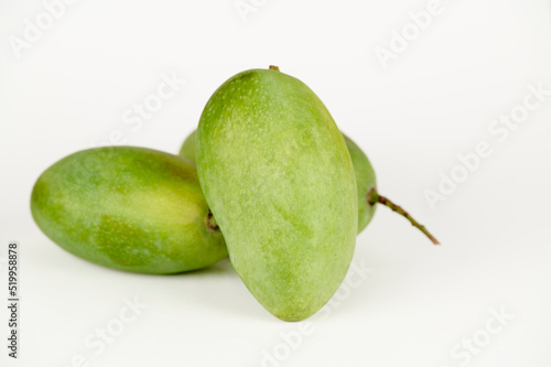Closeup view of three Langda mangoes (Magnifera indica) on a white background