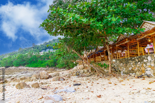 Fototapeta Naklejka Na Ścianę i Meble -  Colourful Skies Sunset over Kalim Beach Patong Pa Tong Beach in Phuket island Thailand. Lovely turquoise blue waters, lush green mountains colourful skies