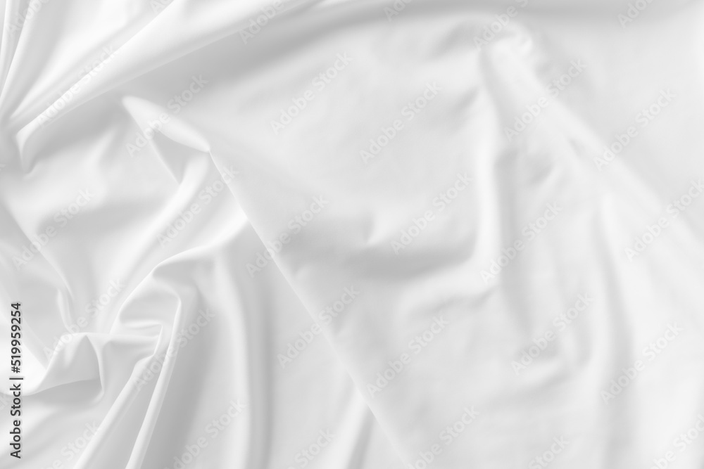 White fabric. luxurious white fabric texture background. Creases of satin, silk, and cotton.	