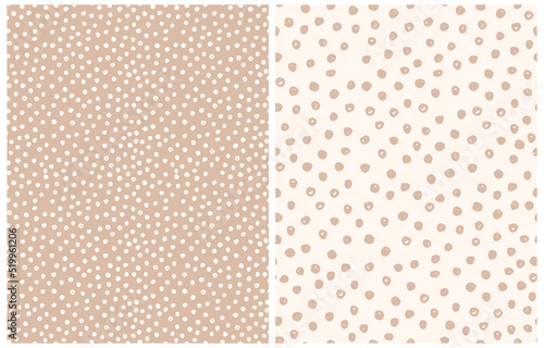 Fototapeta Naklejka Na Ścianę i Meble -  Abstract Hand Drawn Vector Patterns.Beige and White Brush Dots on a Light Brown and Off-White Background. Modern Irregular Geometric Seamless Pattern.Cool Repeatable Dotted Print.Gender Neutral Color.
