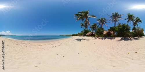 A tropical beach with palm trees and a blue ocean. Saud Beach, Pagudpud. Philippines. 360 panorama. photo