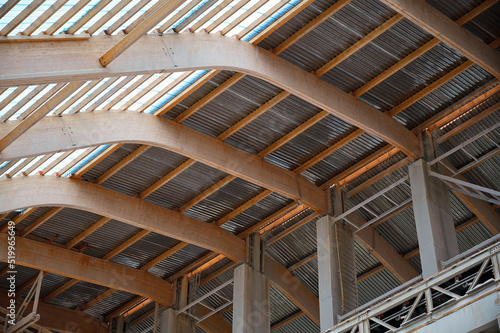 The roof of a warehouse for chemical fertilizers. The wooden beams are covered with transparent plastic