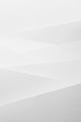 White abstract geometric background with soft light vertical oblique stripes with crossing and angles as pattern in simple monochrome modern style, vertical.