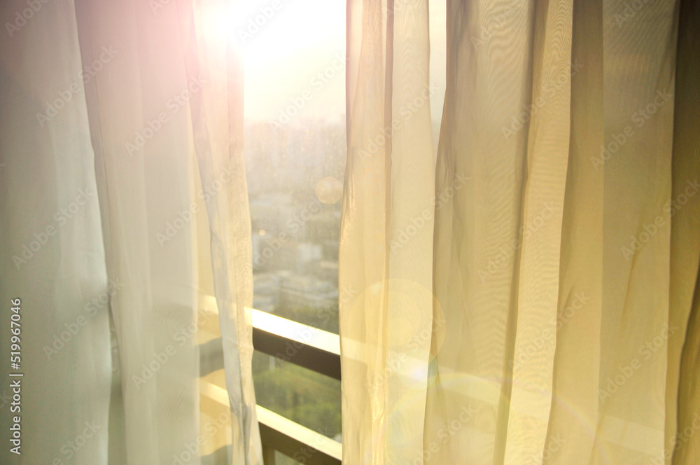 Sunlight through a beautiful curtain in sunset