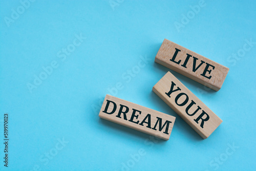 Above are three wooden blocks with the words Live your dream