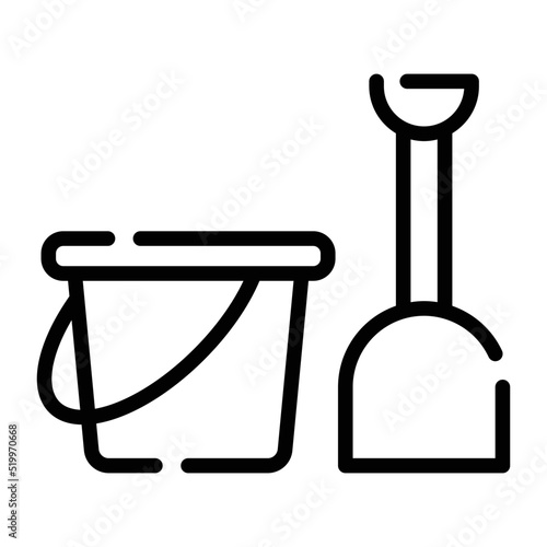 Baby playing with sand pail and shovel toys