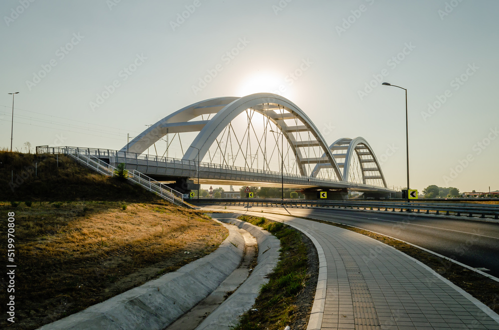 Novi Sad, Serbia. July - 25. 2022. Zezelj bridge on river Danube in Novi Sad. View of the Zezelje Bridge on the Danube in Novi Sad from the Petrovaradin side in the summer and in the afternoon. Novi Sad, Serbia. July - 25. 2022. Zezelj bridge on river Danube in Novi Sad. View of the Zezelje Bridge on the Danube in Novi Sad from the Petrovaradin side in the summer and in the afternoon.